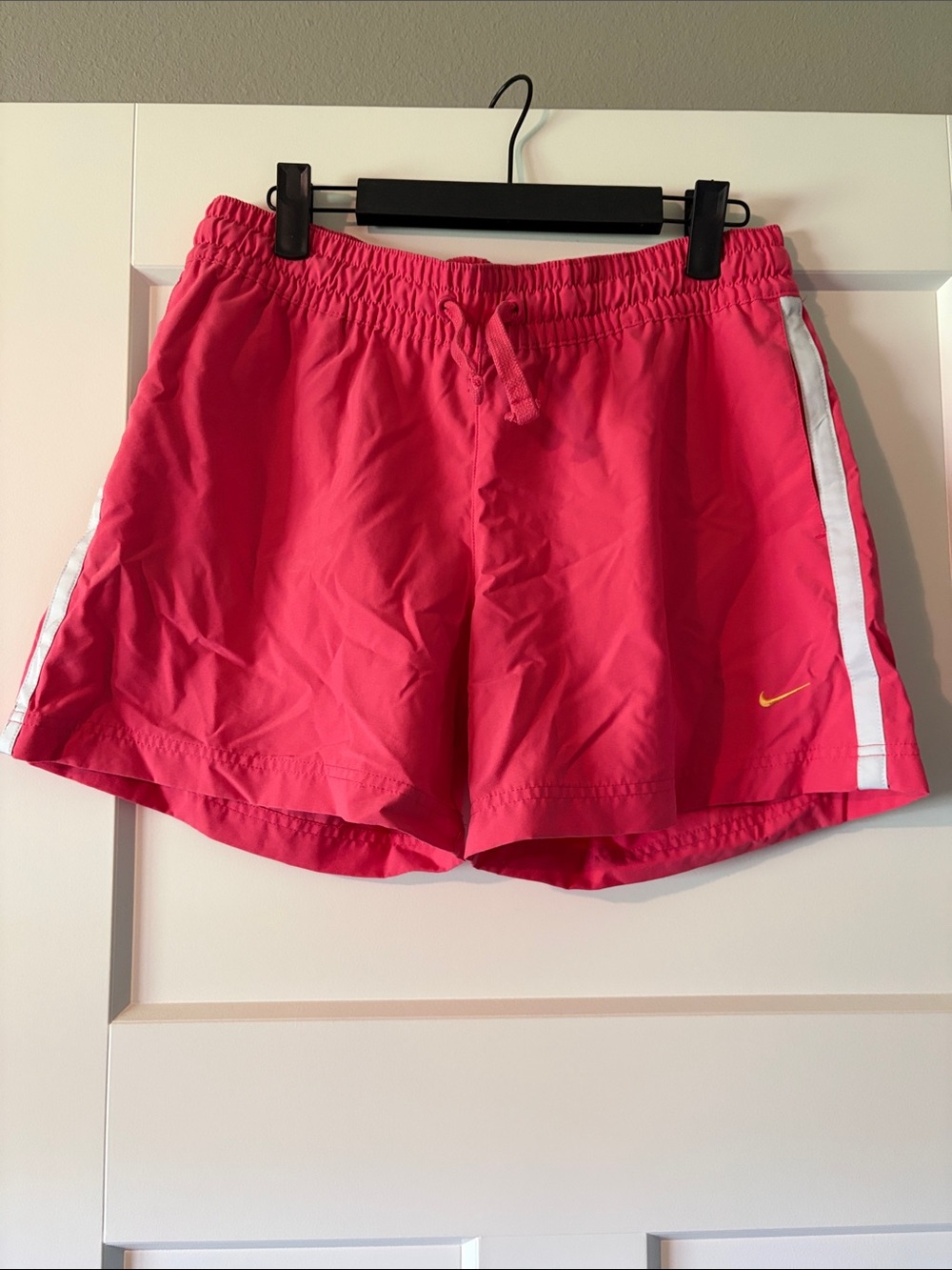 Nike Women's Bright Pink Athletic Shorts with White Side Stripe